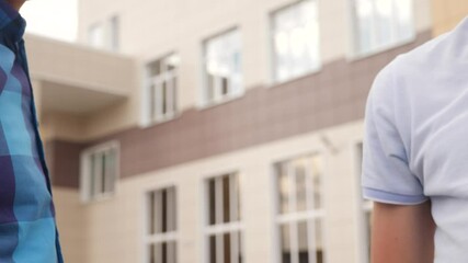 two businessmen touch elbows social distance. bump avoid greeting. coronavirus pandemic concept. two men meeting greet each other at distance observing social distance. bump avoid greeting lifestyle