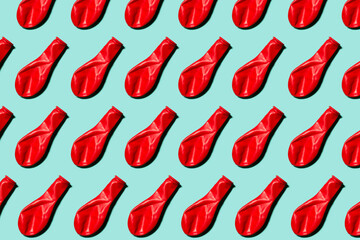 Red balloon pattern on the turquoise background, image for packages, envelopes, and covers. Top view, flat lay