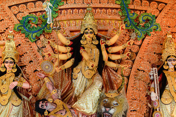 Idol of Goddess Devi Durga at a decorated puja pandal in Kolkata, West Bengal, India. Durga Puja is...