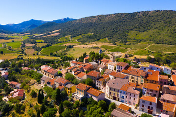 Fototapeta na wymiar Picturesque aerial view of Cucugnan commune with main landmark 17th-century windmill, Aude department, southern France
