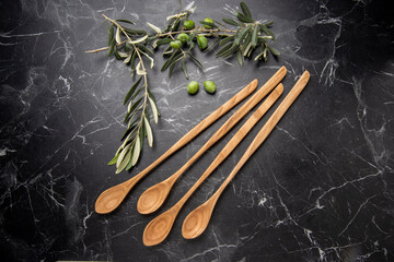 hand carved wooden kitchen tools on the table