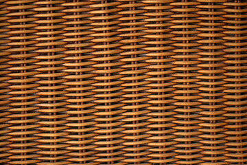 Texture weaving patterns vine on a black background. Wicker Straw Basket