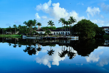 Fototapeta premium Resort clubhouse reflected in a pond 
