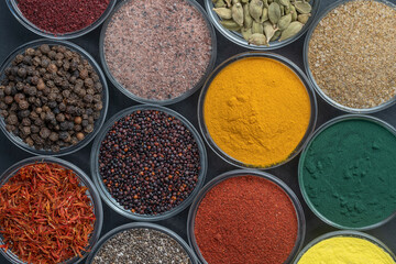 Assortment colorful spices, seeds and herbs for cooking food, top view