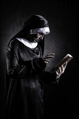 Horror Scene of a Possessed nun Woman with scripture bible textbook and look at camera ghost...