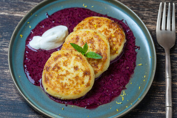 Cheesecakes with mint, honey and sour cream. Delicious dessert, ukrainian food