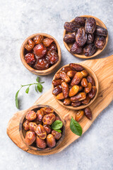 Dates or dattes palm fruit in wooden bowl is snack healthy.