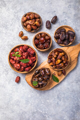 Top view of sweet dried dates (fruits of date palm Phoenix dactylifera). Bright saturated color and good texture.