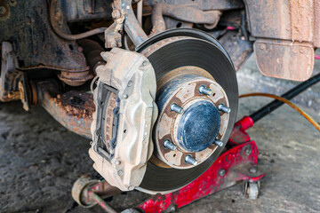 Closeup of car disc brake at Garage.