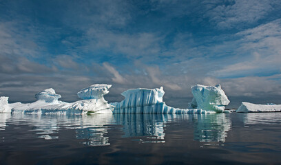 Icebergs reflecting in the water © Nina