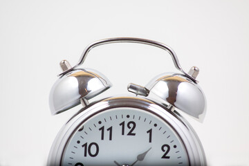 Nice old vintage chrome metal twin bell alarm clock on white background..