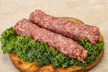 Raw minced beef kebab skewer