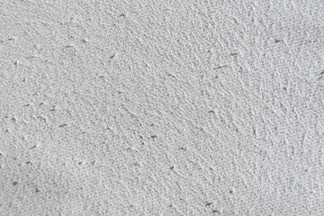 Cotton beige fabric surface texture with pills traces of wear, outdated, used.