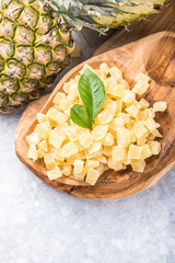 Candide fruit pineapple cubes,   on white background