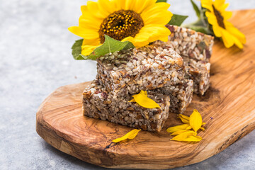 Kozinaki with seeds, nuts, with honey. Useful snacks. Fitness nutrition, nutritious snack, energy bar.