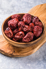 Fototapeta na wymiar Bowl of dried unabi fruit or jujube .Medicinal and edible plant