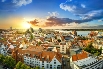 panoramic view at the city center of rostock while sunset, germany - obrazy, fototapety, plakaty
