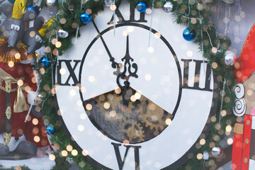 postcard new year's clock, five minutes before the new year. clock decorated with Christmas toys.