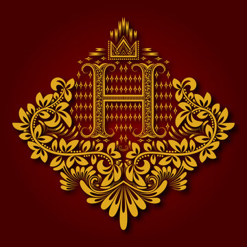 Letter H heraldic monogram in coats of arms form. Vintage golden logo with shadow on maroon background. Letter H is surrounded by floral elements of design.