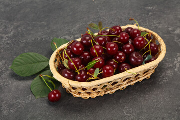 Fototapeta na wymiar Sweet ripe cherry with leaves