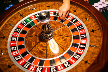 Close-up of luxury casino wooden roulette wheel.