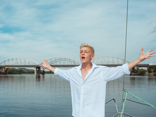 handsome Caucasian boy on the yacht 