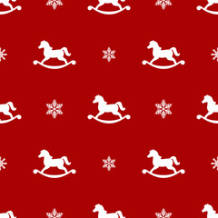 seamless winter pattern with white snowflakes and horse toys.