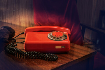 Vintage old dial telephone on the wooden table