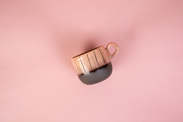 porcelain coffee cup on pink background