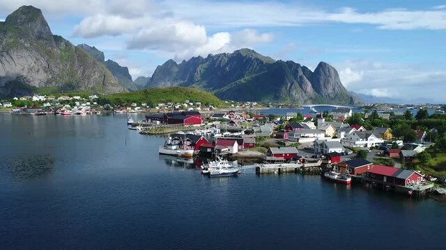 view of a beautiful town with a bay whis boats in the fjords