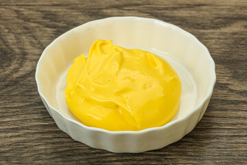 Natural cheese sauce in the bowl
