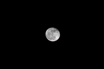 FUJAIRAH, UNITED ARAB EMIRATES - NOV 11th, 2017: Isolated shot of a summers full moon in a dark night