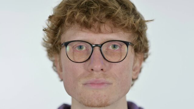 Close up of Serious Face of Redhead Young Man, White Background