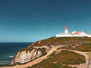 Fototapeta na wymiar Roca Cape lighthouse in the westernmost point of Europe