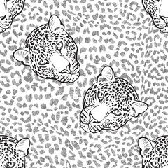 Leopard fur texture and leopard faces. Seamless pattern. Hand-drawn vector illustration. Animal art background. © maritime_m