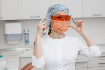 pretty female doctor wearing medical mask