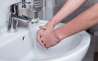 Man washing hands with soap. For corona virus prevention and hygiene