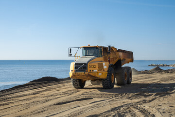 bulldozer on the beach - Industrial dumper at the construction site in the beach