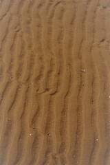 textured pattern on yellow sand