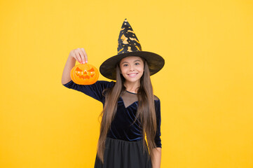 celebrate the holidays. jack o lantern. halloween witch girl. happy childhood. teenage child in...