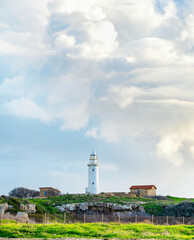 Fototapeta na wymiar Clouds lighthouse seaside Paphos Cyprus