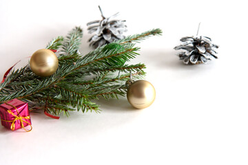 Christmas decoration on a white background. Christmas gifts and golden Christmas balls. Place for...