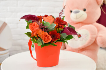 Obraz na płótnie Canvas Fresh flowers in box, beautiful flower arrangement on table.