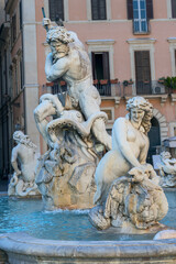 fragment of a fountain with antique sculptures in the historic center of Rome