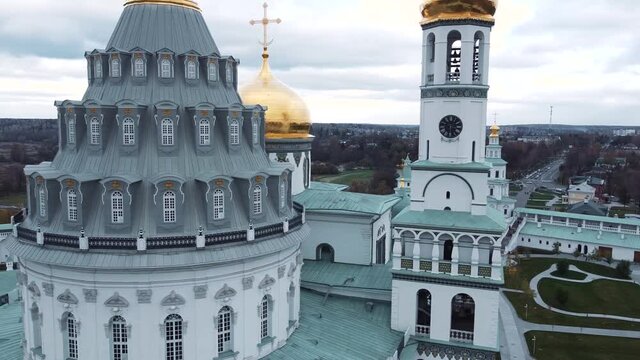 drone shooting, flying near the chapel and the copals of the monastery, clock tower and bell