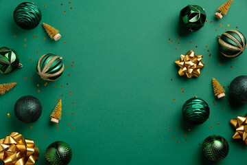 Christmas green background with baubles and golden decorations. Xmas frame with copy space. Greeting card mockup, banner template.