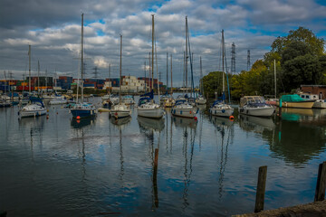 Fototapeta na wymiar A view of boats moored on the River Test at Eling near Southampton, UK in Autumn