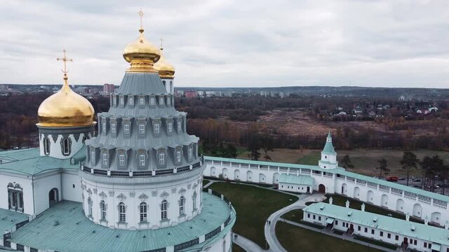 drone shooting, flying near the chapel and the copals of the monastery, clock tower and bell