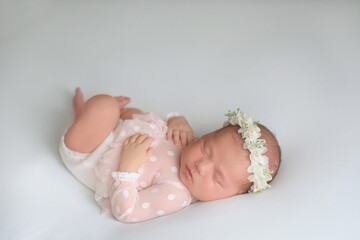 Photo of newborn baby sleeping at home. First days of life 