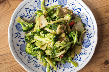 Stir fried broccoli in plate. Asian street food